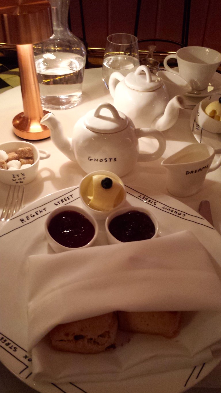 Chai tea, scones, strawberry jam, fig jam and clotted cream.